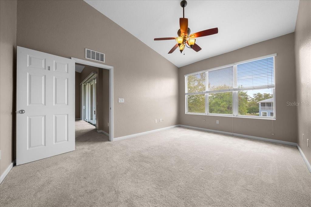 4555 Southwest 52nd Circle, Unit 106 Ocala, FL 34474 - Photo 21 of 100 a view of a livingroom with a ceiling fan and window