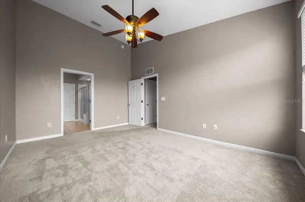 a room with gym equipment and mirrors