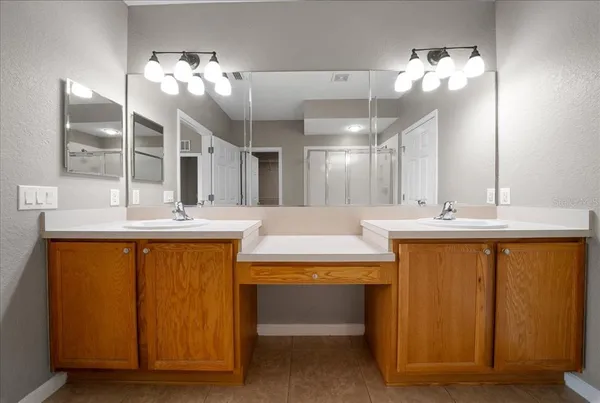 a living room with furniture a flat screen tv and a large window