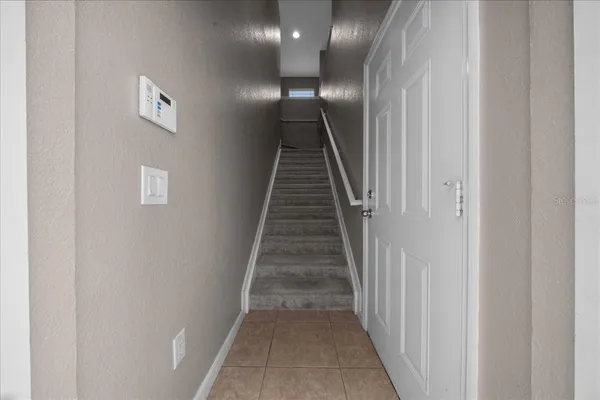 a kitchen with stainless steel appliances granite countertop a stove a refrigerator and a microwave