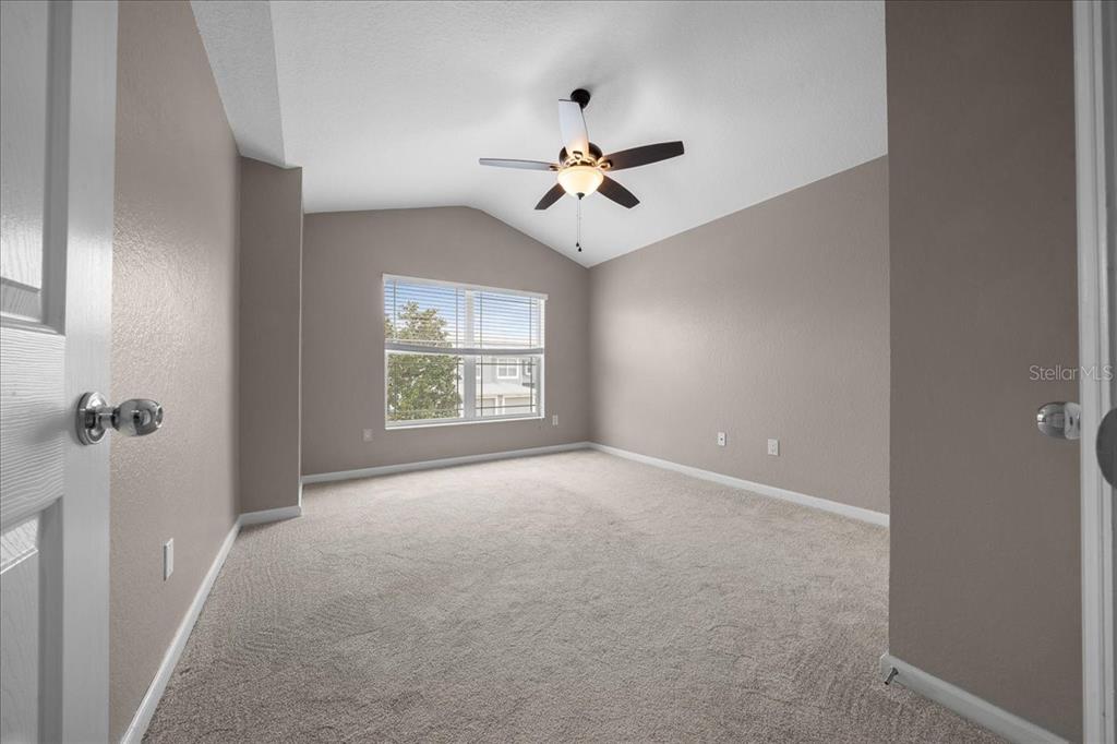 4555 Southwest 52nd Circle, Unit 106 Ocala, FL 34474 - Photo 32 of 100 an empty room with windows and fan