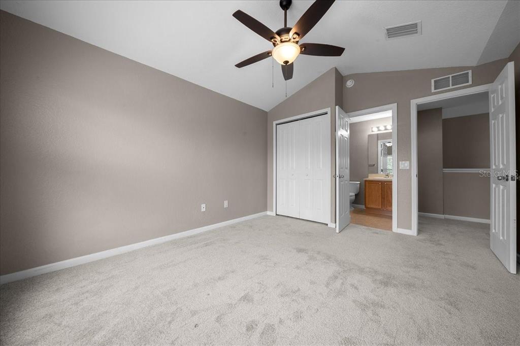 4555 Southwest 52nd Circle, Unit 106 Ocala, FL 34474 - Photo 34 of 100 an empty room with a ceiling fan and a window