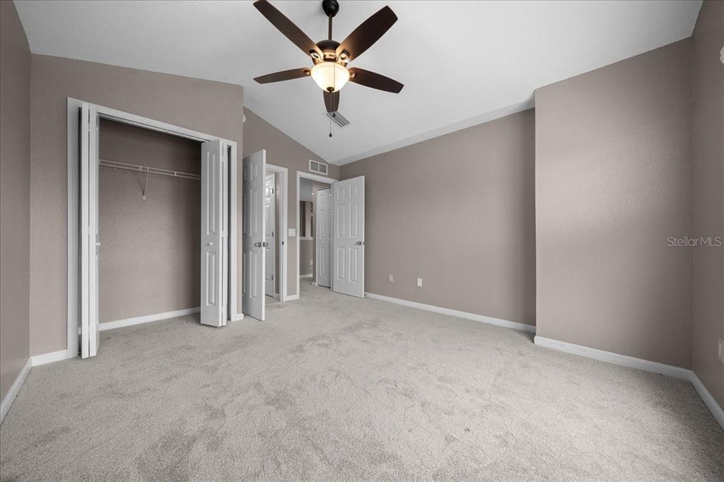4555 Southwest 52nd Circle, Unit 106 Ocala, FL 34474 - Photo 35 of 100 an empty room with closet and a ceiling fan