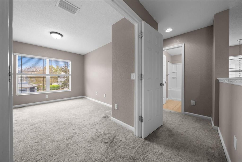 4555 Southwest 52nd Circle, Unit 106 Ocala, FL 34474 - Photo 40 of 100 an empty room with windows and closet