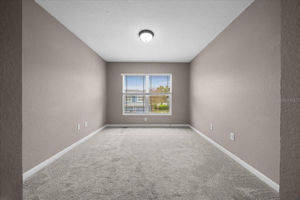 4555 Southwest 52nd Circle, Unit 106 Ocala, FL 34474 - Photo 41 of 100 an empty room with windows