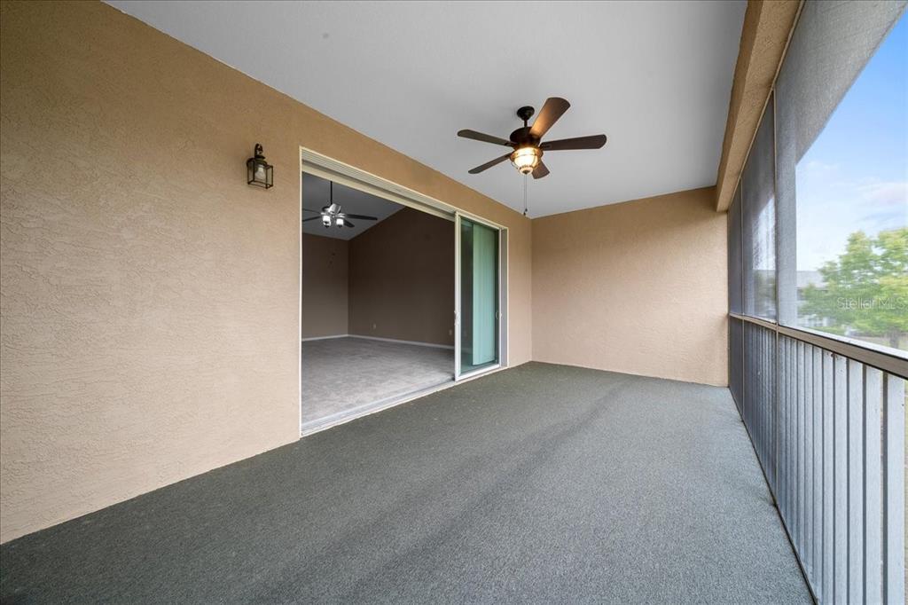 4555 Southwest 52nd Circle, Unit 106 Ocala, FL 34474 - Photo 45 of 100 a view of a livingroom with a ceiling fan and window