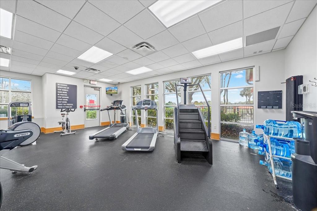 4555 Southwest 52nd Circle, Unit 106 Ocala, FL 34474 - Photo 48 of 100 a view of a room with gym equipment