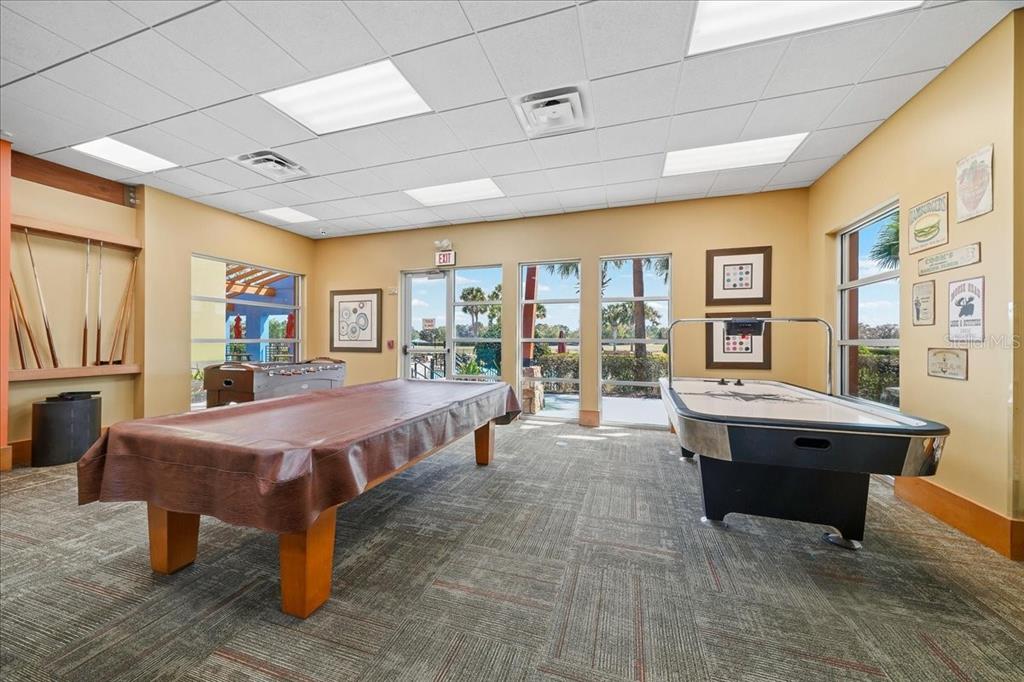 4555 Southwest 52nd Circle, Unit 106 Ocala, FL 34474 - Photo 53 of 100 a spacious bedroom with a large bed and a table