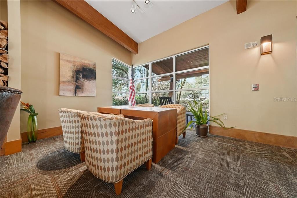 4555 Southwest 52nd Circle, Unit 106 Ocala, FL 34474 - Photo 60 of 100 a living room with a couch and a table