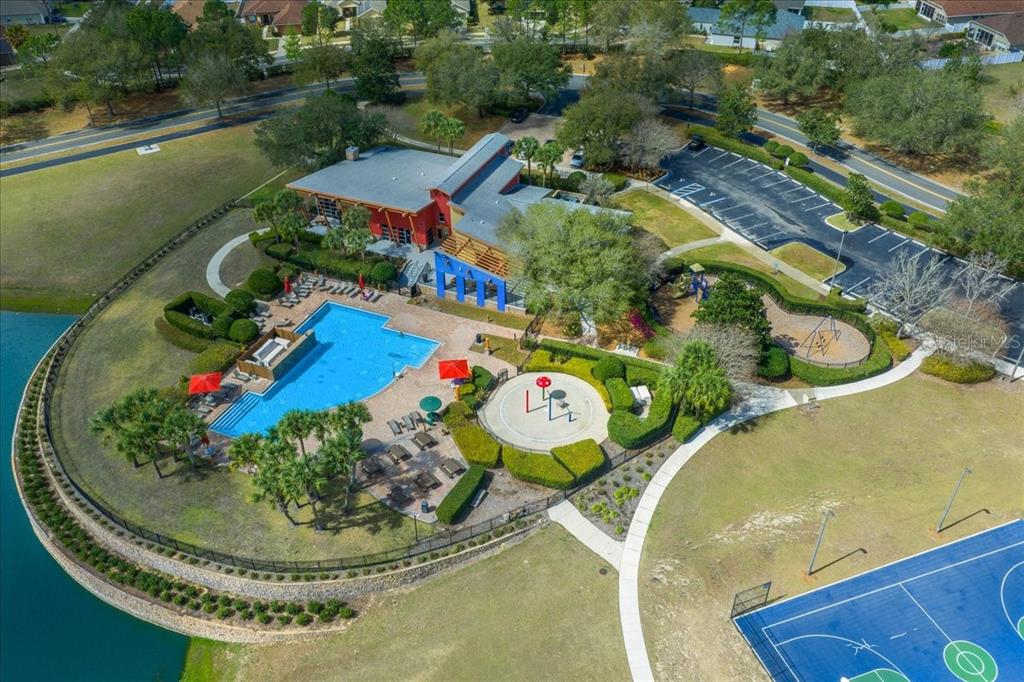 4555 Southwest 52nd Circle, Unit 106 Ocala, FL 34474 - Photo 71 of 100 a view of a swimming pool with some plants and flowers