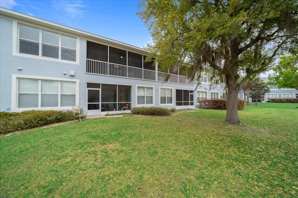4555 Southwest 52nd Circle, Unit 106 Ocala, FL 34474 - Photo 80 of 100 a house view with a garden space