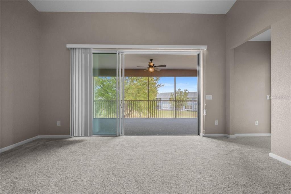 4555 Southwest 52nd Circle, Unit 106 Ocala, FL 34474 - Photo 8 of 100 a view of an empty room with a window