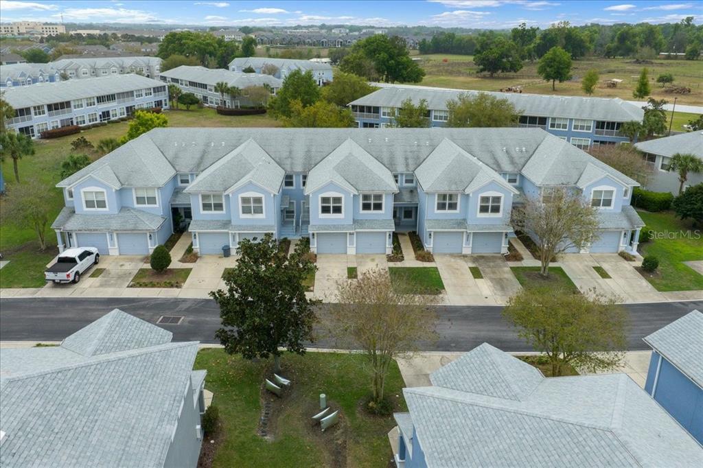 4555 Southwest 52nd Circle, Unit 106 Ocala, FL 34474 - Photo 88 of 100 an aerial view of a house with a garden