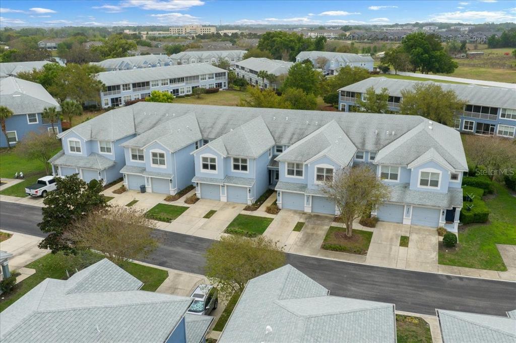 4555 Southwest 52nd Circle, Unit 106 Ocala, FL 34474 - Photo 89 of 100 an aerial view of a house with a big yard