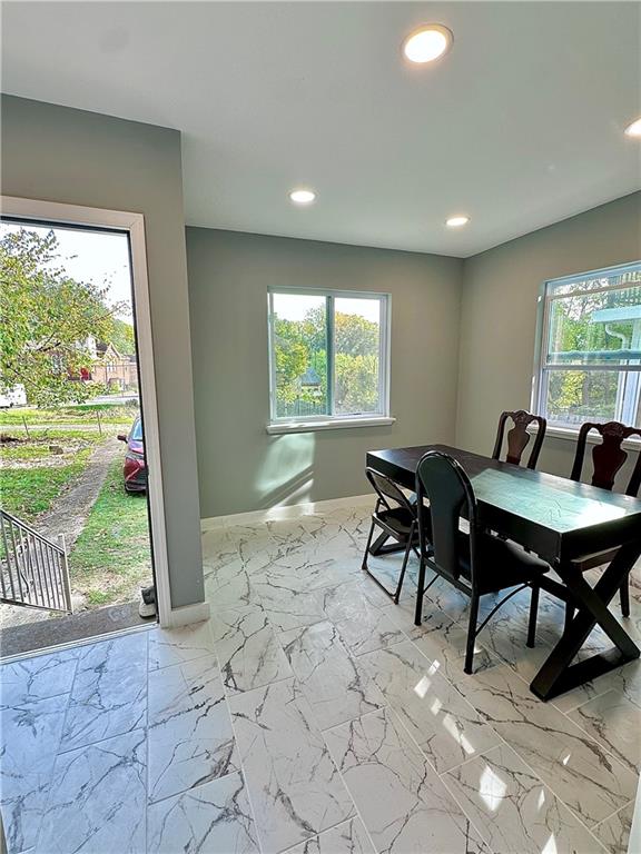 94 Lafferty Avenue Pittsburgh, PA 15210 - Photo 19 of 35 a living room with furniture and a floor to ceiling window