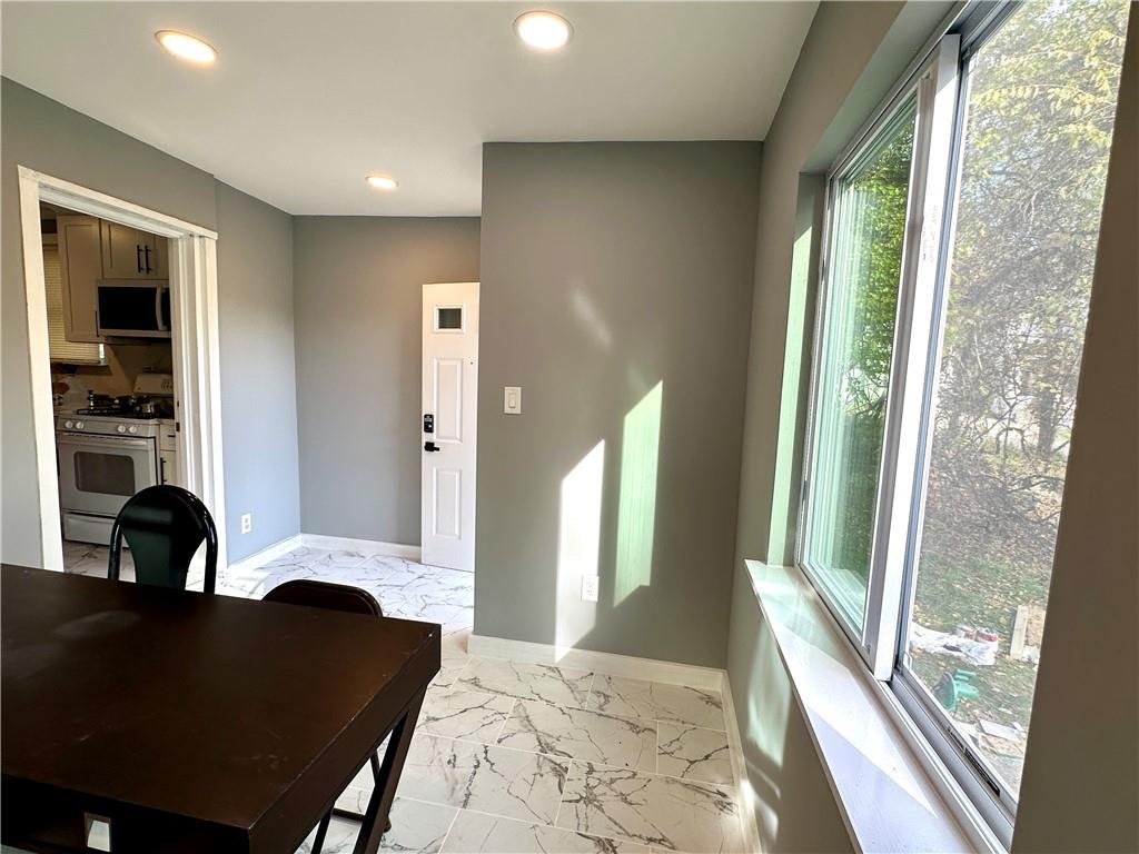 94 Lafferty Avenue Pittsburgh, PA 15210 - Photo 20 of 35 a living room with furniture and a large window