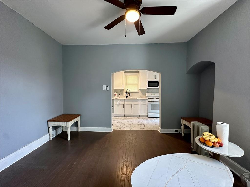 94 Lafferty Avenue Pittsburgh, PA 15210 - Photo 23 of 35 a living room with furniture and a wooden floor
