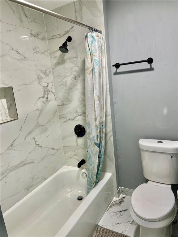 94 Lafferty Avenue Pittsburgh, PA 15210 - Photo 26 of 35 a white toilet sitting next to a bath tub and a shower