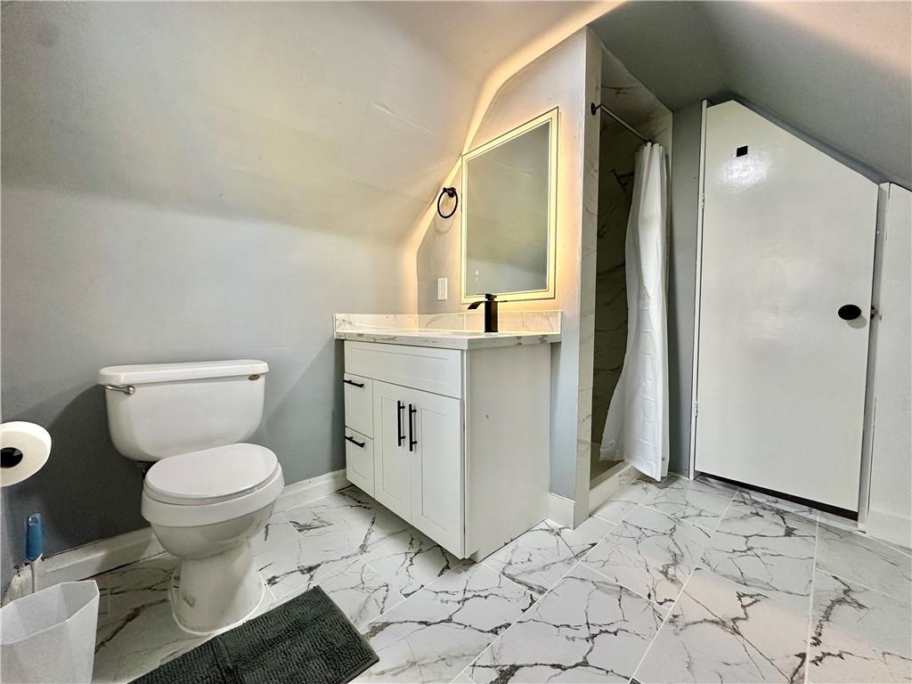 94 Lafferty Avenue Pittsburgh, PA 15210 - Photo 30 of 35 a bathroom with a sink toilet and shower