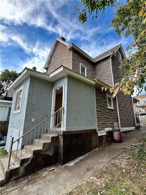 94 Lafferty Avenue Pittsburgh, PA 15210 - Photo 7 of 35 a house with small trees in front of it