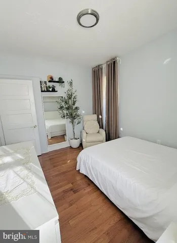 a bedroom with a bed and dresser