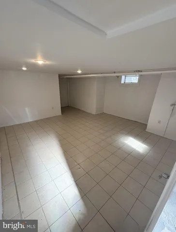 a room with a bed and utility room