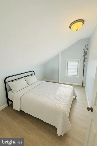 a view of a room with wooden floor and chair