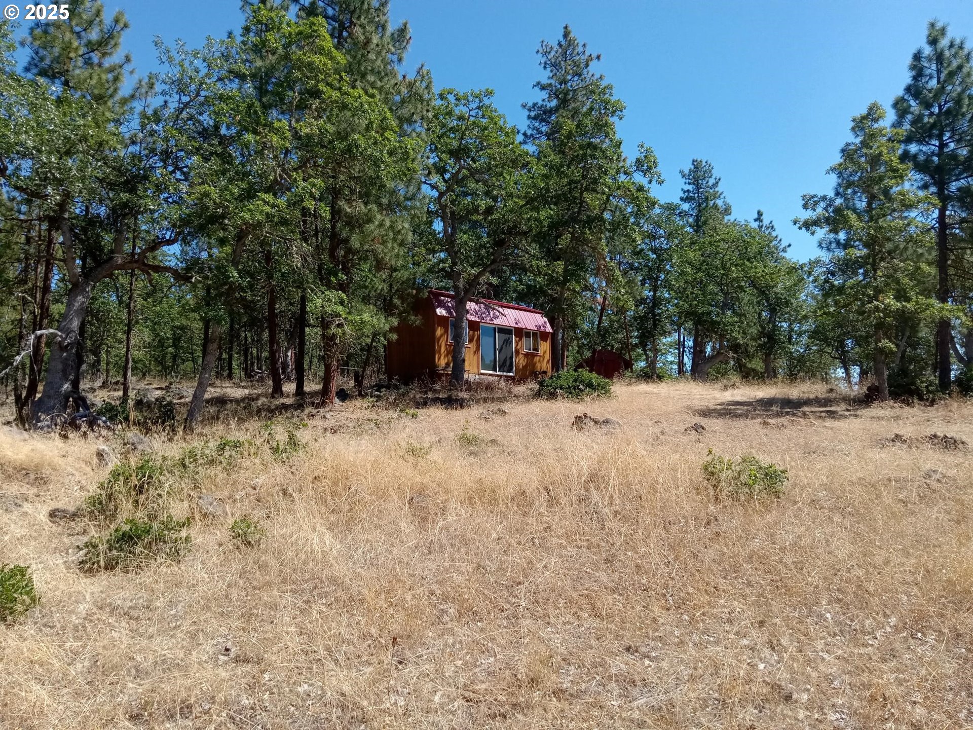 a view of a house with a snow in the yard