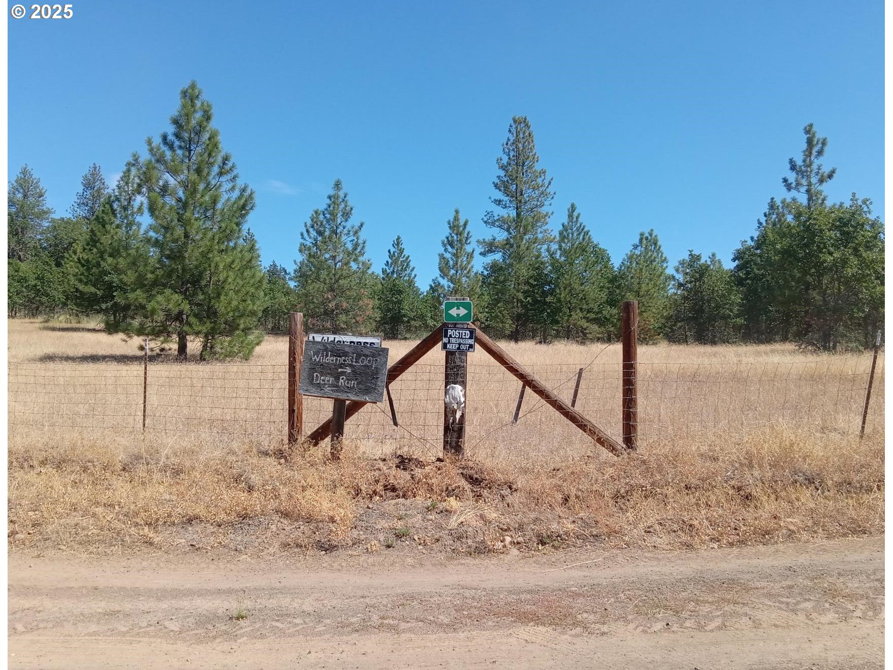 Wilderness Loop, Unit 7576 Goldendale, WA 98620 - Photo 12 of 16 a view of a wooden deck with a backyard