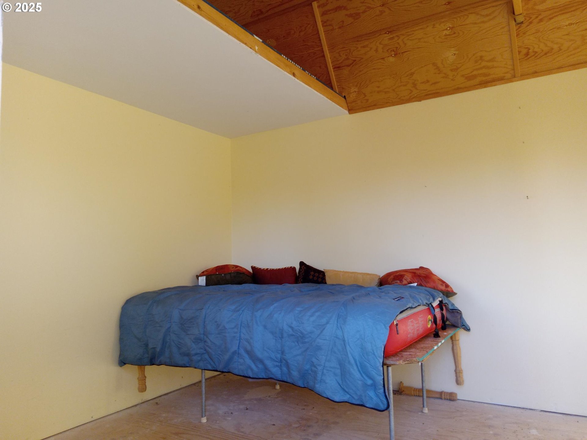 Wilderness Loop, Unit 7576 Goldendale, WA 98620 - Photo 2 of 16 a bedroom with a bed and a dresser