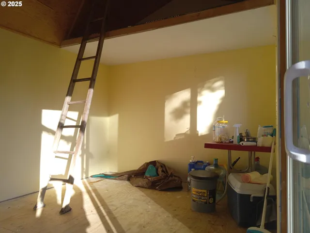 a room with a chair and gym equipment