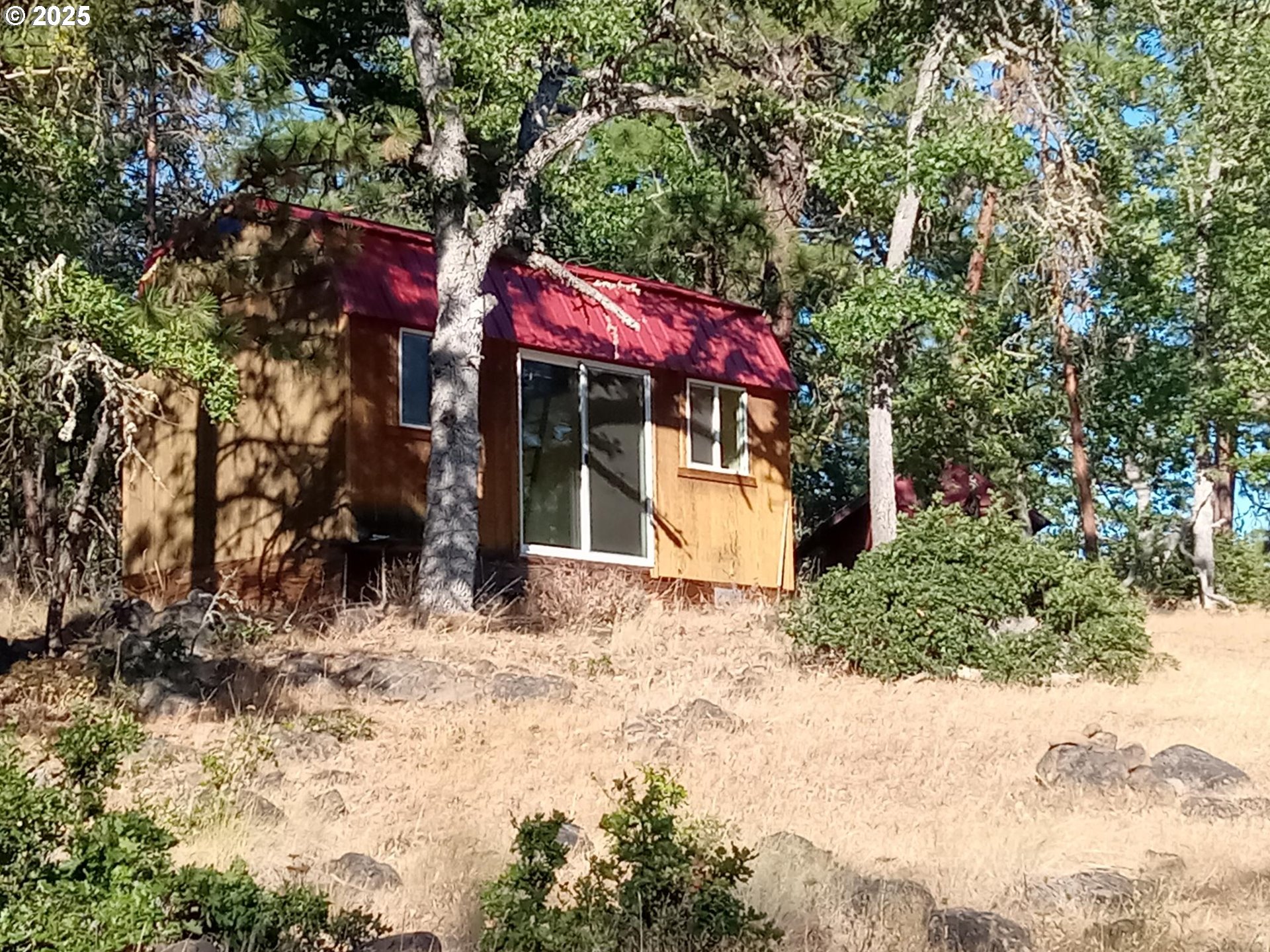 Wilderness Loop, Unit 7576 Goldendale, WA 98620 - Photo 4 of 16 a view of a house with a tree