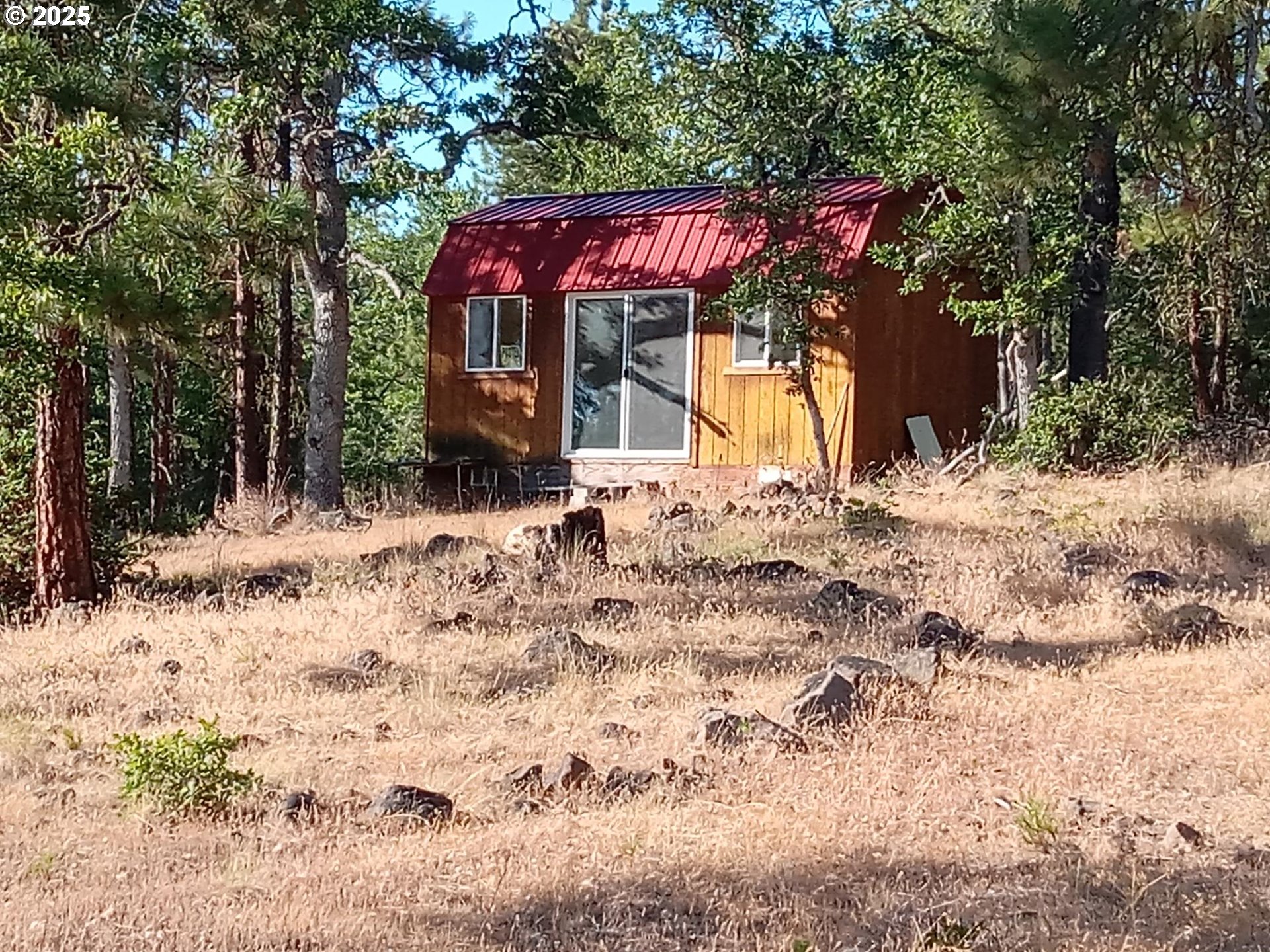 Wilderness Loop, Unit 7576 Goldendale, WA 98620 - Photo 5 of 16 a view of a house with a yard covered in snow