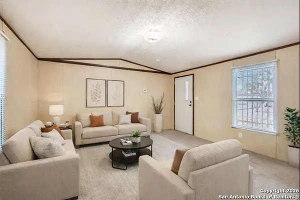 a living room with furniture and a window