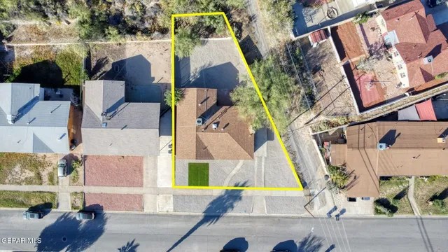 an aerial view of a house with swimming pool