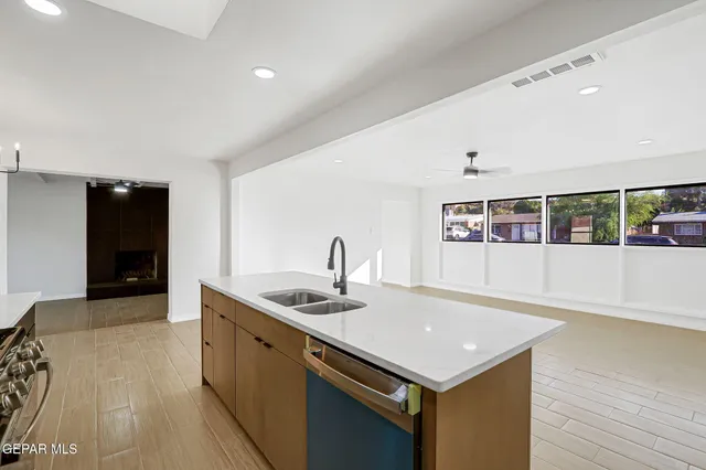 a kitchen with a sink and stove