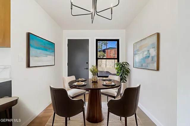 a dining room with furniture and window