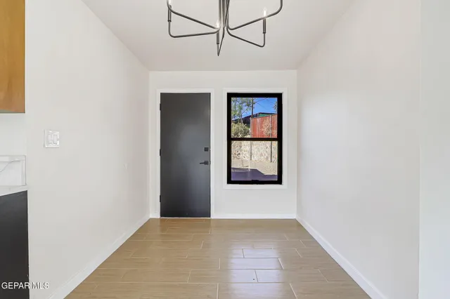 a view of an empty room with a window