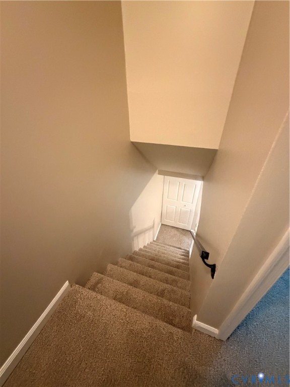 4605 Cogbill Road Richmond, VA 23234 - Photo 19 of 20 Carpeted staircase featuring a painted handrail an