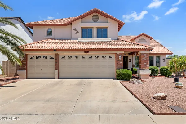 a front view of a house with yard