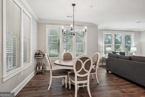 a kitchen with stainless steel appliances granite countertop a refrigerator stove and sink