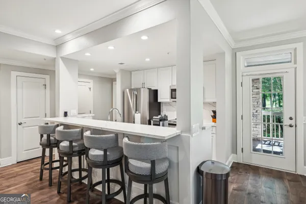 a view of a dining room with furniture window and wooden floor