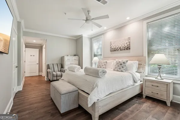 a bedroom with a large bed and a window