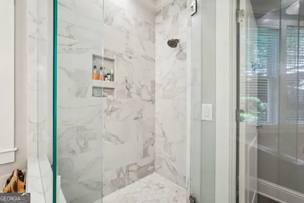 a bedroom with a bed and a night stand