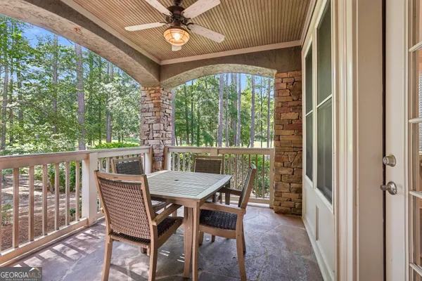 a balcony view with a seating space
