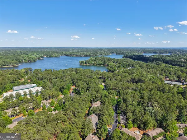 an aerial view of a houses with yard