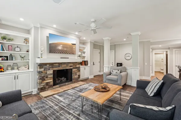 a living room with furniture and a fireplace