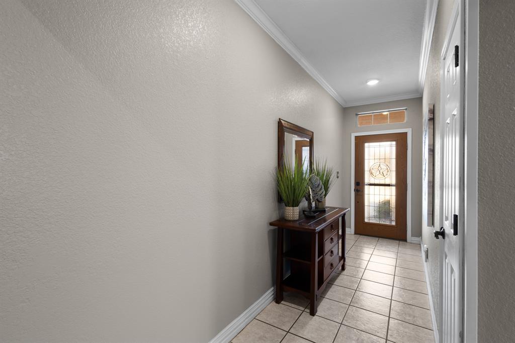 1701 Oakmeadow Drive Decatur, TX 76234 - Photo 28 of 39 a hallway with sink and wooden floor