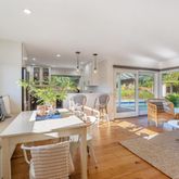 a view of a dining room with furniture window and outside view