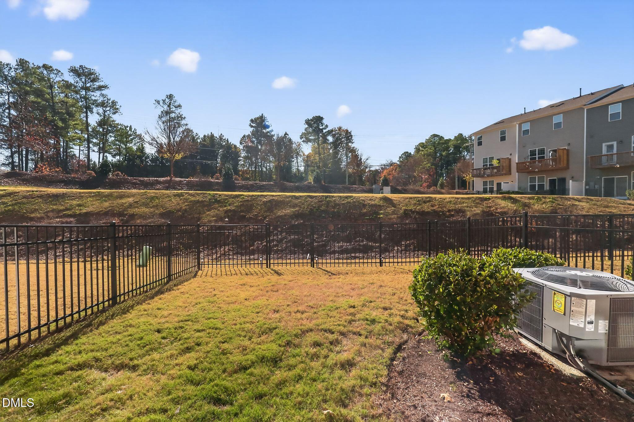1118 Commack Drive Durham, NC 27703 - Photo 23 of 30 a view of a swimming pool with a yard